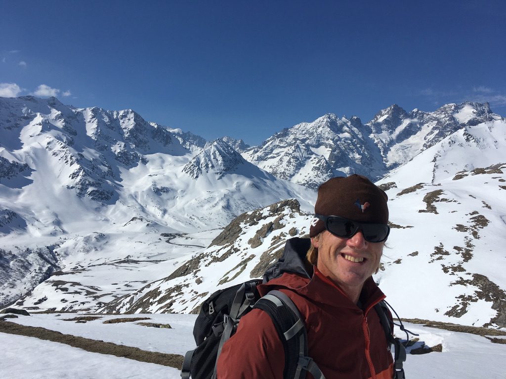 Ian in front of snowy mountains